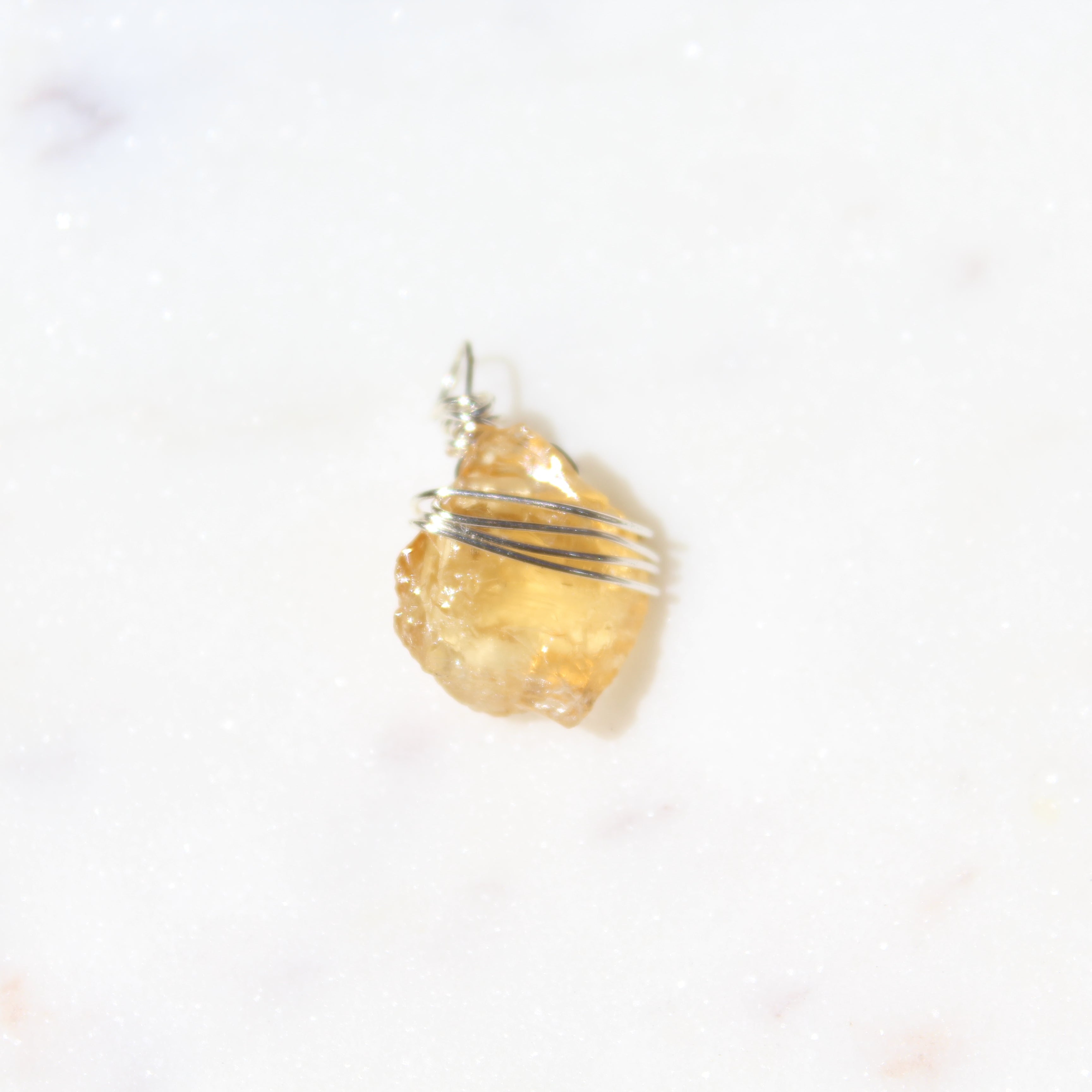 Gold pendant on a white background